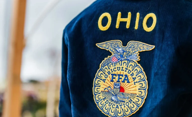 Student wearing official blue FFA jacket at National FFA convention