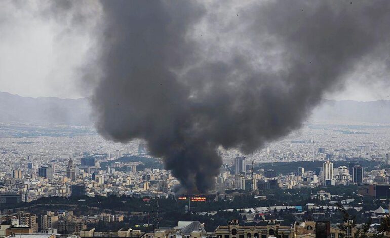 Black smoke rising over Tehran as military operations intensify in the city.